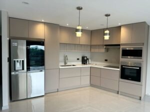 Black and Wood L Shaped Kitchen with Brass Fixtures