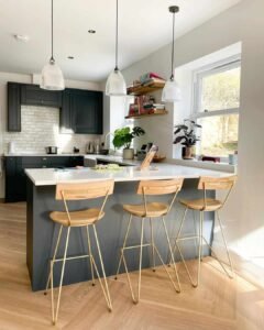 Chic Peninsula Kitchen with Marble Countertops