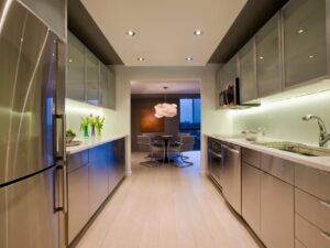Small minimalist double galley kitchen with efficient storage.