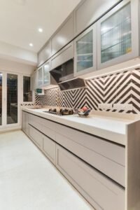 Grey Modular Kitchen with Chevron Tile Backsplash