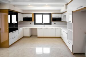 Small White U-Shaped Kitchen with Overhead Storage